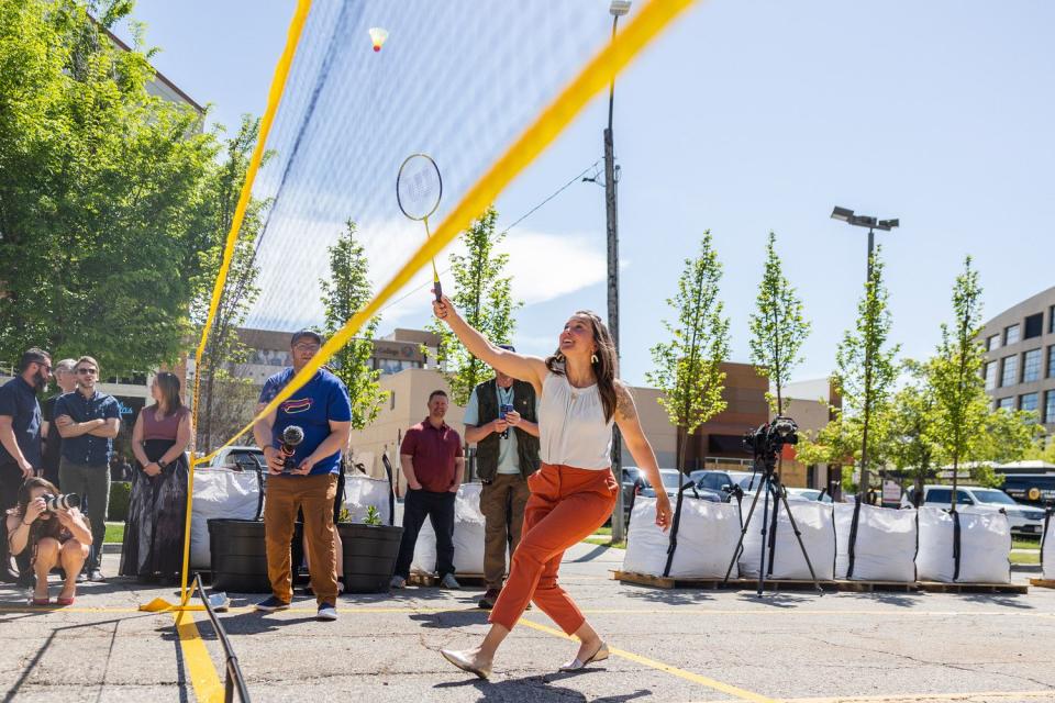 Salt Lake City Mayor Erin Mendenhall plays badminton during the unveiling of the “Green Loop,” a temporary public park at 200 E. 300 South in downtown Salt Lake City on Monday.