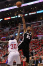 LOS ANGELES, CA - MAY 19: Tim Duncan #21 of the San Antonio Spurs shoots over Reggie Evans #30 of the Los Angeles Clippers in Game Three of the Western Conference Semifinals in the 2012 NBA Playoffs on May 19, 2011 at Staples Center in Los Angeles, California. NOTE TO USER: User expressly acknowledges and agrees that, by downloading and or using this photograph, User is consenting to the terms and conditions of the Getty Images License Agreement. (Photo by Stephen Dunn/Getty Images)