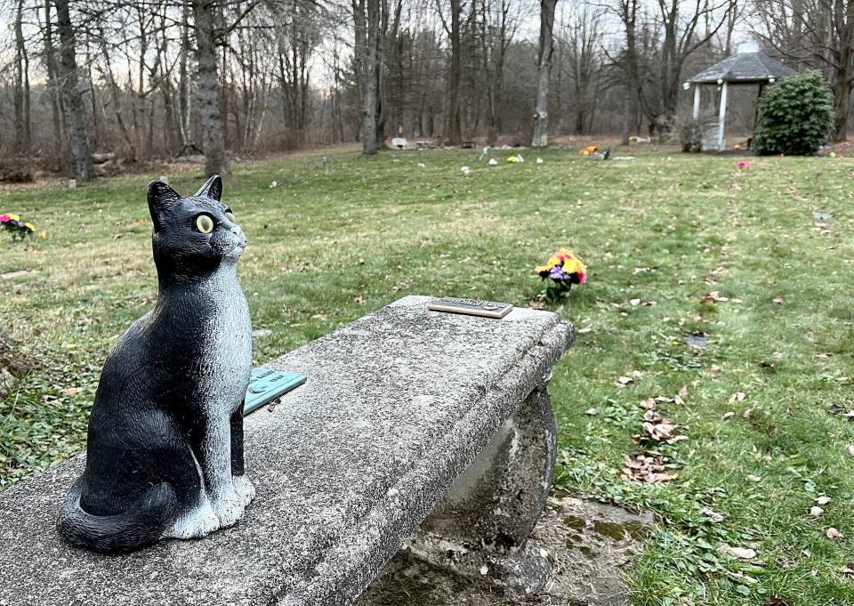 A memorial bench for pets belonging to the Reilly family sits at Hearthside Pet Cemetery, 6330 Rick Road in McKean Township on Dec. 5, 2022.