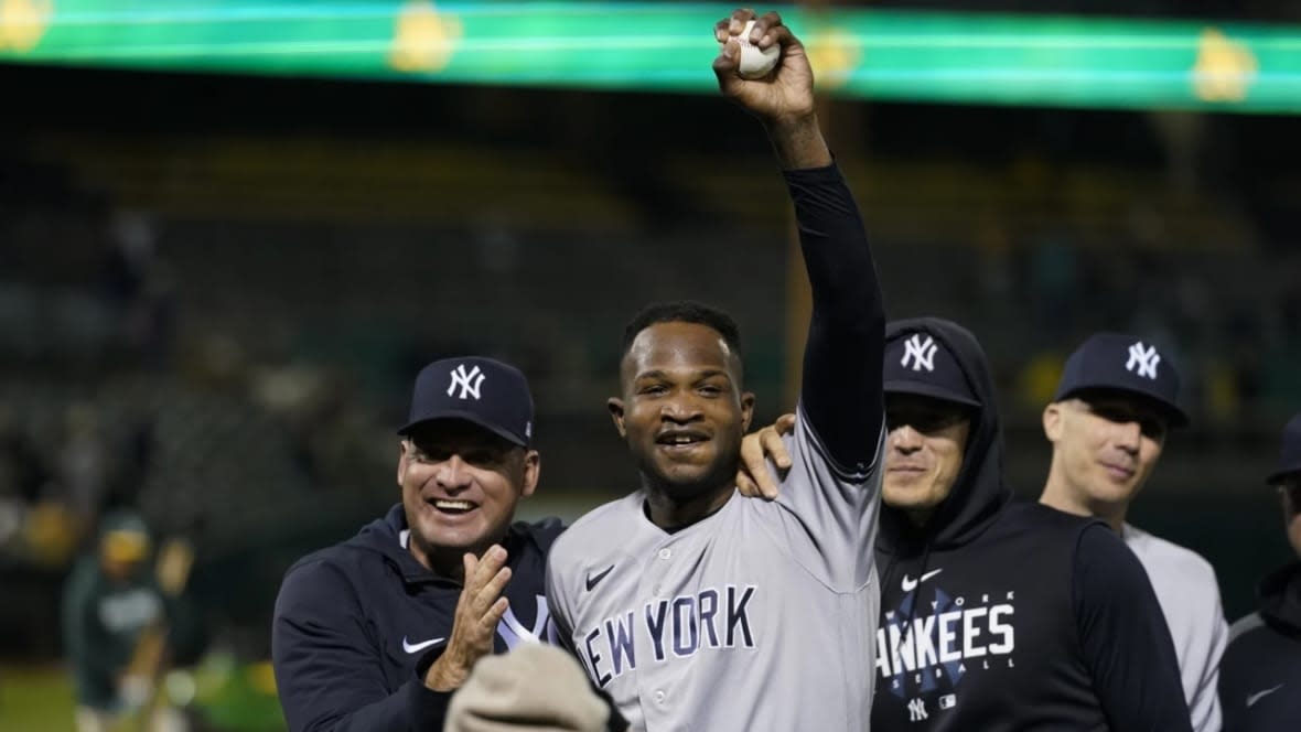 New York Yankees’ Domingo Germán (center) celebrates after pitching a perfect game against the Oakland Athletics during a baseball game in Oakland, California Wednesday, June 28, 2023. The Yankees won 11-0. (Photo: Godofredo A. Vásquez/AP)