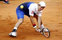 Kei Nishikori of Japan returns the ball to Novak Djokovic of Serbia during their match at the Rome Open tennis tournament in Rome, Italy, May 15, 2015. REUTERS/Stefano Rellandini