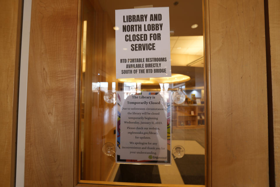 Signs are placed on the outside doors to advise visitors that the library as well as a restroom are closed because of meth contamination Thursday, Jan. 12, 2022, in the south Denver suburb of Englewood, Colo. (AP Photo/David Zalubowski)