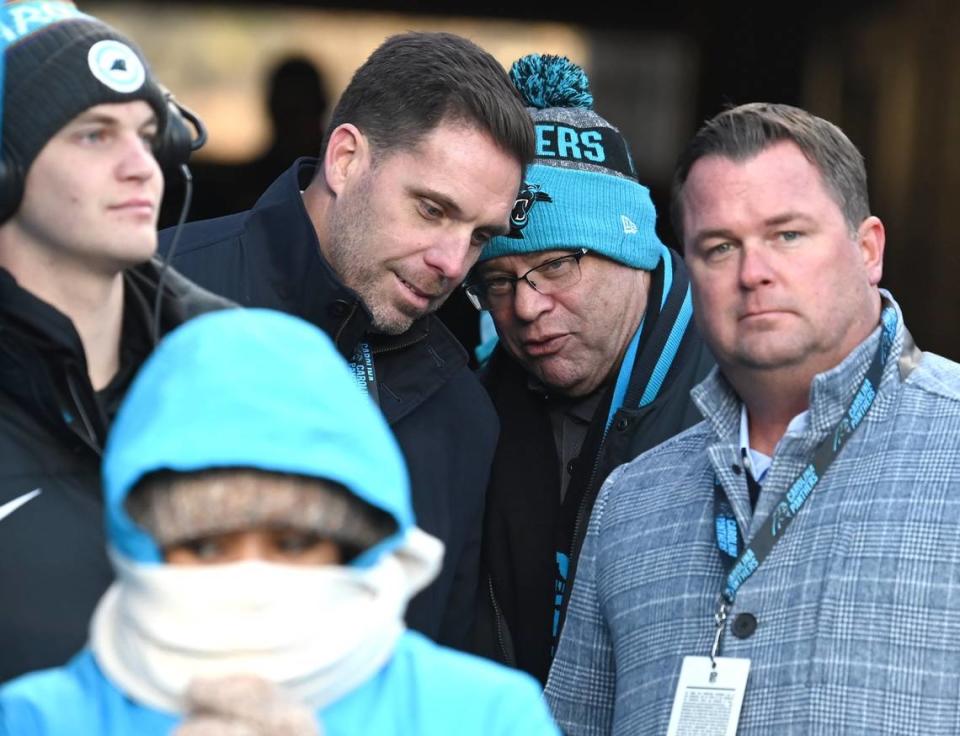 Carolina Panthers assistant general manager Dan Morgan, left, speaks with team owner David Tepper, right, during the closing moments of the team’s 37-23 victory over the Detroit Lions at Bank of America Stadium on Saturday, December 24, 2022 in Charlotte, NC. At right is team general manager Scott Fitterer.