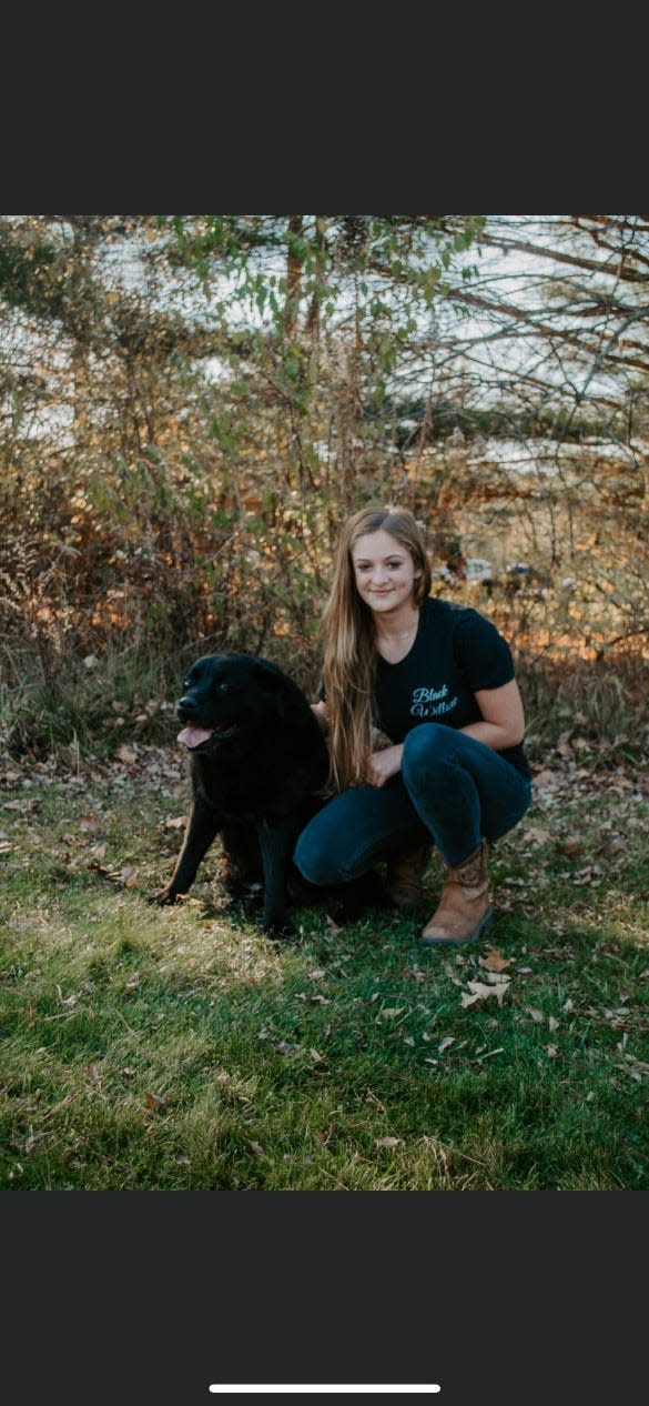 The Beller family loves their dog Willow so much they named their food truck business after her. Willow is seen here with Lucy, a daughter of Bryan and Jessica Beller.