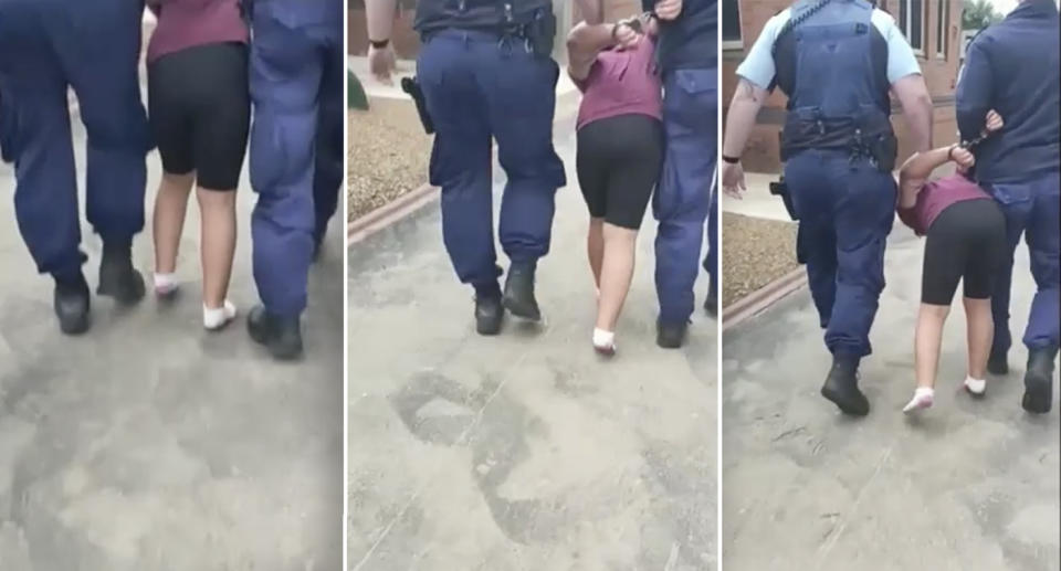 A nine-year-old girl is led away in handcuffs by two police officers after she suffered a meltdown at school.