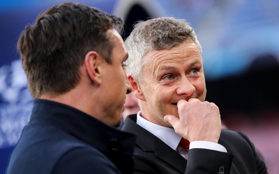 Ole Gunnar Solskjaer the head coach / manager of Manchester United and Gary Neville - Getty Images