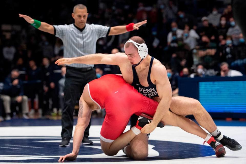 Penn State’s Max Dean grabs his opponent during a wrestling dual between Penn State and Rutgers on Sunday, Jan. 16, 2022 at Rec Hall in University Park, Pa. Penn State defeated the Scarlet Knights 27-11.