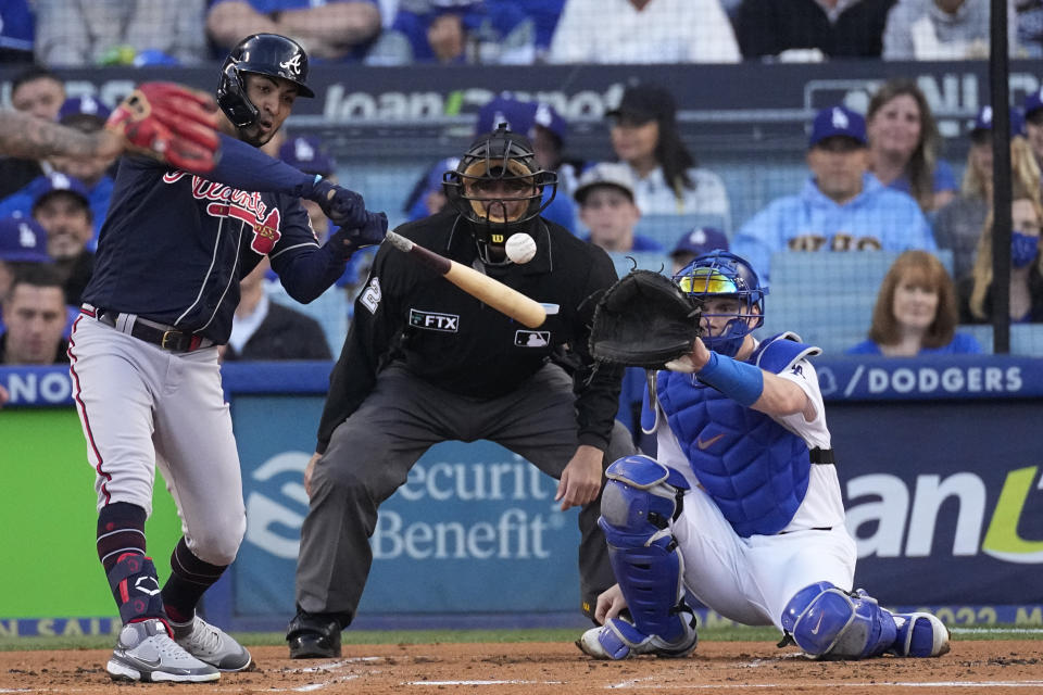 Atlanta Braves' Eddie Rosario hits a solo home run during the second inning in Game 4 of baseball's National League Championship Series against the Los Angeles Dodgers Wednesday, Oct. 20, 2021, in Los Angeles. (AP Photo/Marcio Jose Sanchez)