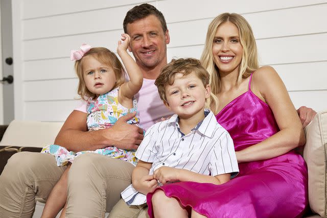 <p>Simon Bruty/Sports Illustrated/Getty</p> Summer Olympics Preview: Portrait of USA Ryan Lochte with his wife Kayla, daughter Liv and son Caiden at home during photo shoot in Gainesville, Florida.