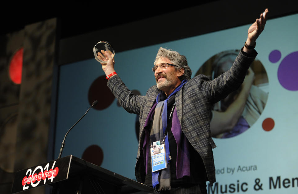 Michael Rossato-Bennett, director of "Alive Inside: A Story of Music & Memory," accepts the Audience Award: U.S. Documentary during the 2014 Sundance Film Festival Awards Ceremony on Saturday, Jan. 25, 2014, in Park City, Utah. (Photo by Chris Pizzello/Invision/AP)