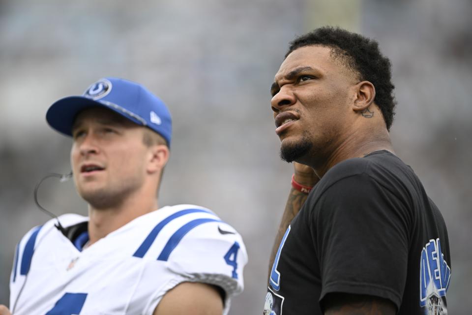 Indianapolis Colts quarterback Anthony Richardson, right, watches during the first half of an NFL football game against the Jacksonville Jaguars, Sunday, Oct. 6, 2024, in Jacksonville, Fla. (AP Photo/Phelan M. Ebenhack)