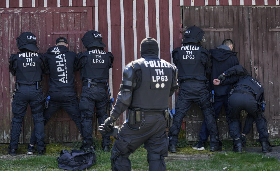 FILE - Hundreds of German local state police and federal police practice tactics in preparation for the European Championship in the village of Stützerbach, in Ilmenau, Germany, April 23, 2024. A recent surge in violence around soccer games is contributing to alarm over security when Germany hosts the European Championship. Some 22,000 police officers will be on duty each day for the tournament. (AP Photo/Ebrahim Noroozi, File)