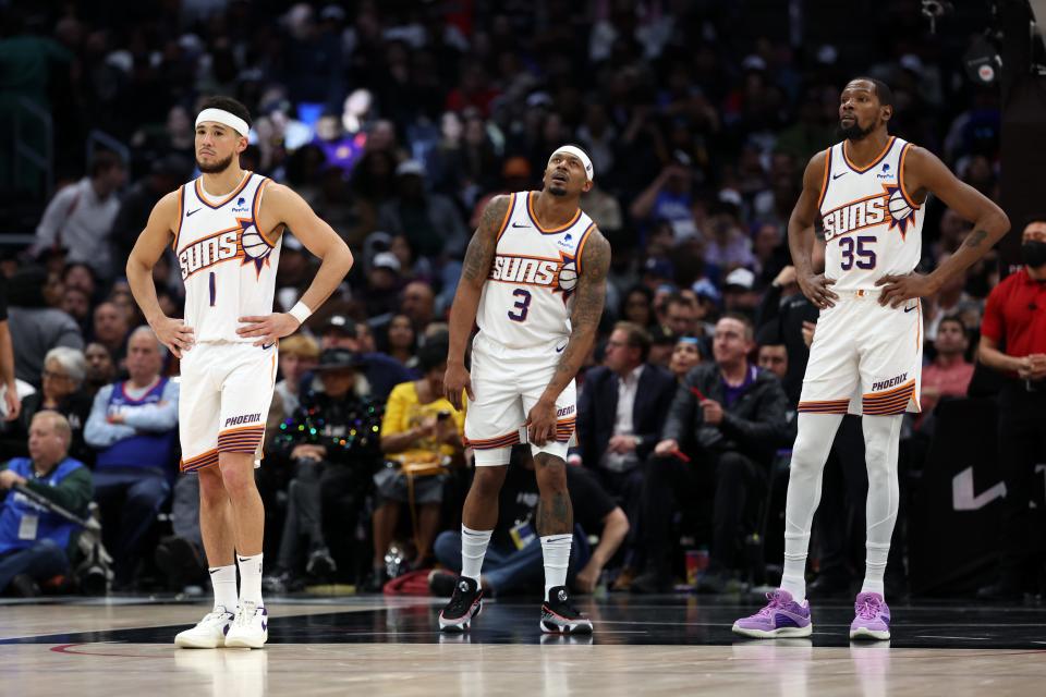Phoenix Suns guards Devin Booker (1), Bradley Beal (3) and forward Kevin Durant (35) stand on the floor during the fourth quarter against the Los Angeles Clippers at Crypto.com Arena in Los Angeles on Jan. 8, 2024.
