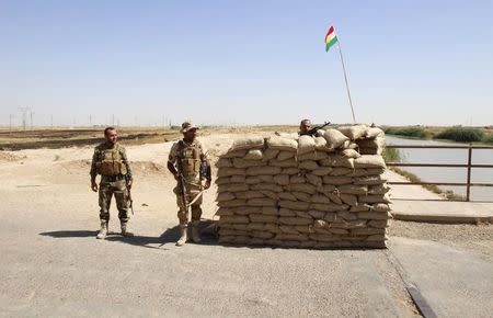 Members of the Kurdish security forces take part in an intensive security deployment in the outskirts of Kirkuk, June 16, 2014. REUTERS/ Ako Rasheed