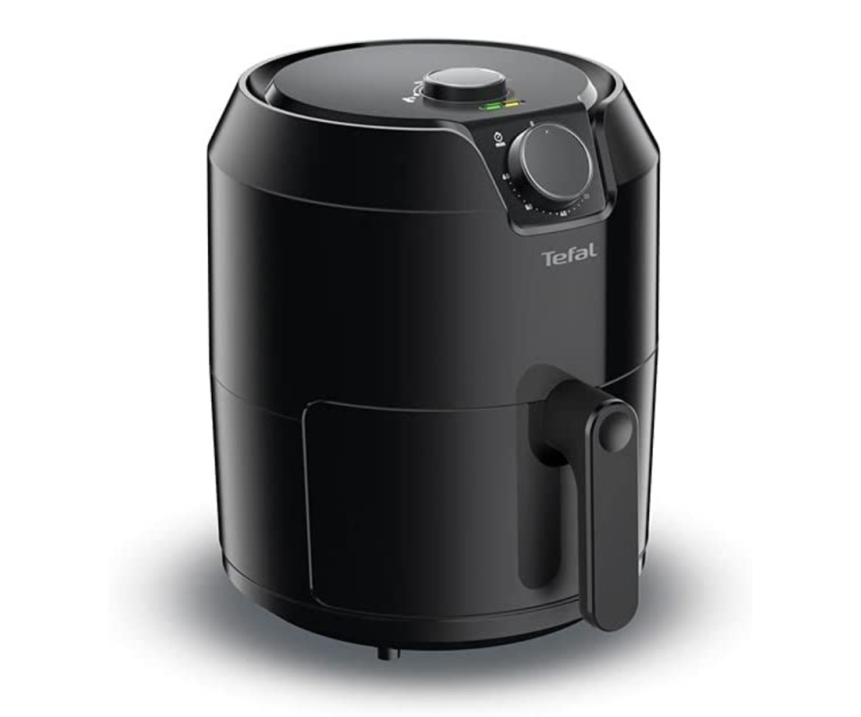 Tefal's black Air Fryer sits on an angle against a white background.