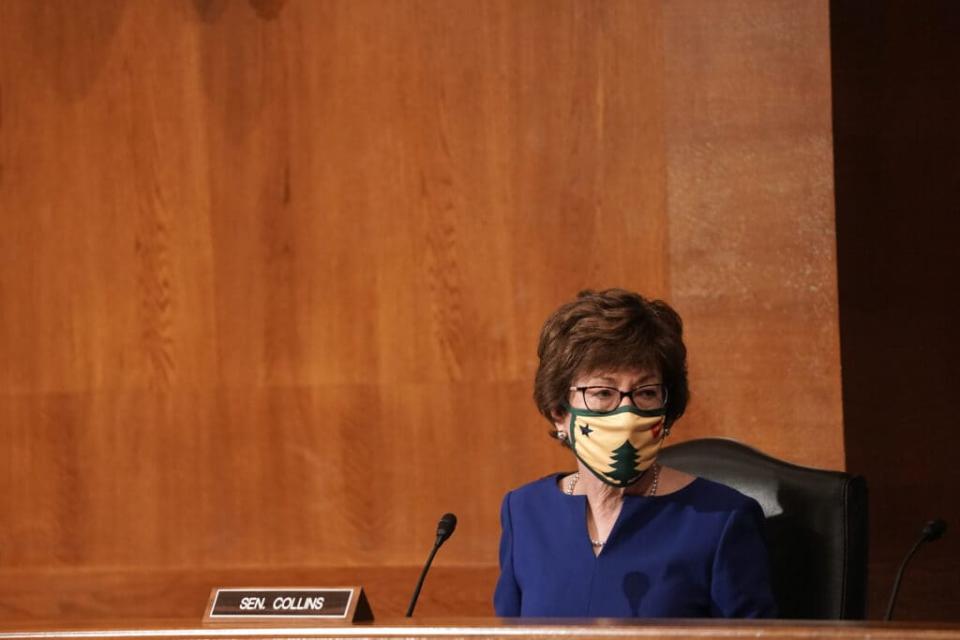 Sen. Susan Collins (R-ME) listens to Surgeon General Jerome Adams give an opening statement during a Senate Health, Education, Labor, and Pensions Committee hearing to discuss vaccines and protecting public health during the coronavirus pandemic. (Photo by Greg Nash- Pool/Getty Images)