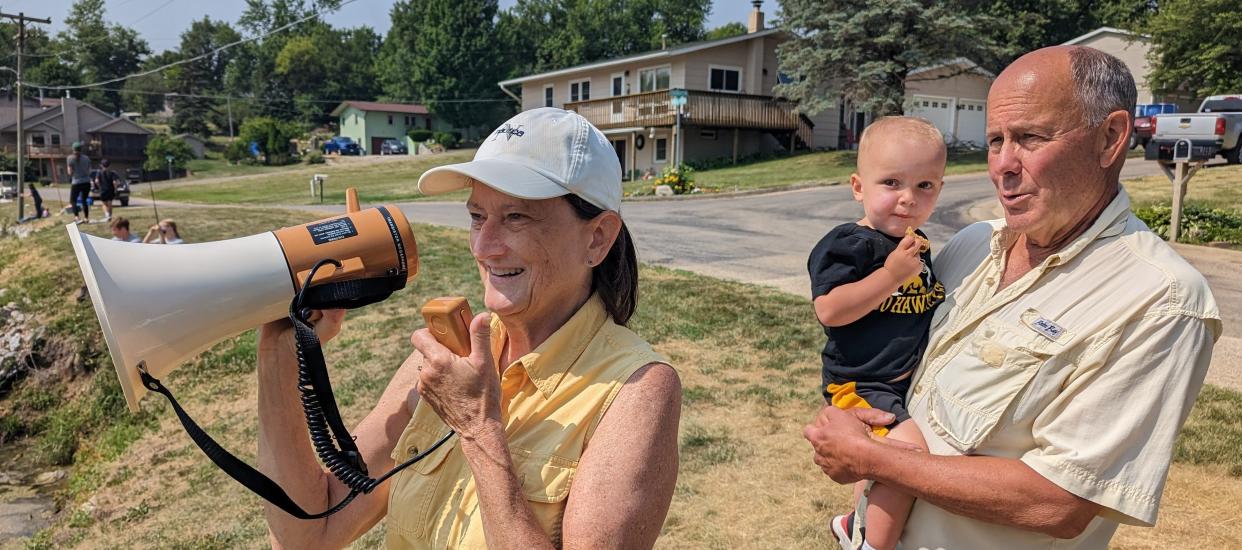 Sue and Joe Wilkinson, with grandson Tyler Hall, are the ramrods of this annual neighborhood fishing derby near Solon. Sue announced the winner of a  “pond prize” every 15 minutes to the crowd.