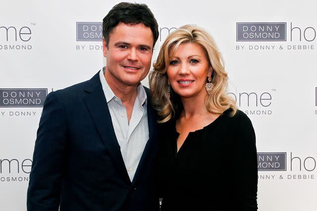 <p>Brian Ach/WireImage</p> Donny and Debbie Osmond in September 2013
