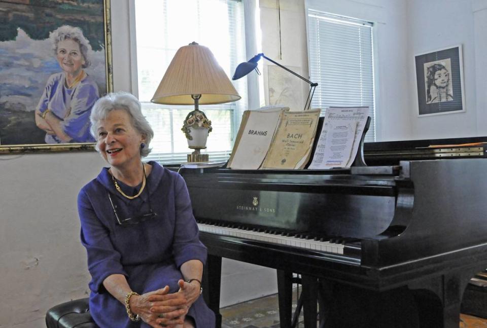 Ruth Greenfield, now in her late 80s, sits in front of a painting of herself by her husband, Wednesday, March 21, 2012. Greenfield, a musical prodigy herself, started Miami’s first interracial arts school in the 50s, angering some whites when she taught black students. She lives in a historic family home in Spring Garden and remains a force in Miami arts circles.