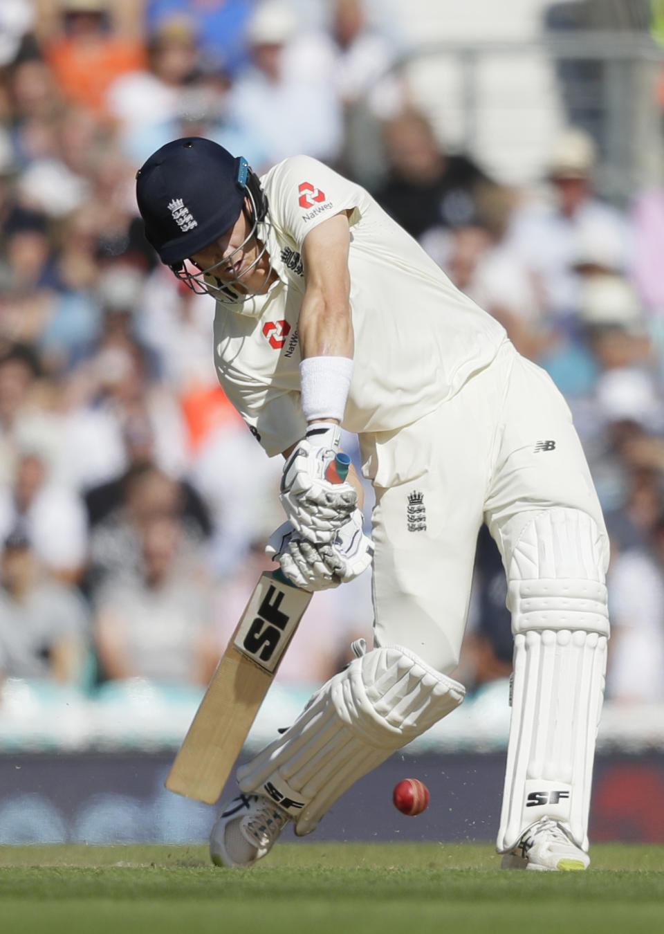 England's Joe Denly plays a shot off the bowling of Australia's Nathan Lyon during the third day of the fifth Ashes test match between England and Australia at the Oval cricket ground in London, Saturday, Sept. 14, 2019. (AP Photo/Kirsty Wigglesworth)