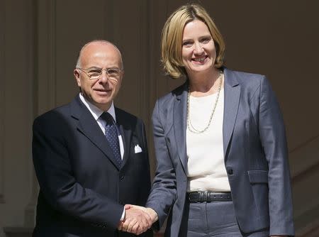 French Interior Minister Bernard Cazeneuve (L) welcomes Britain's Home Secretary Amber Rudd before a meeting in Paris, France, August 30, 2016. REUTERS/Gonzalo Fuentes