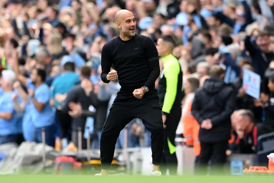 Pep Guardiola reacts to Erling Haaland’s first goal of the day against Man United (Getty Images)