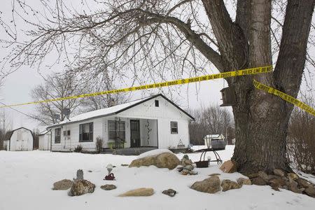 Police tape surrounds one of the crime scenes where gunman, Joseph Jesse Aldridge, killed seven people on Thursday night in Tyrone, Missouri February 27, 2015. REUTERS/Kate Munsch