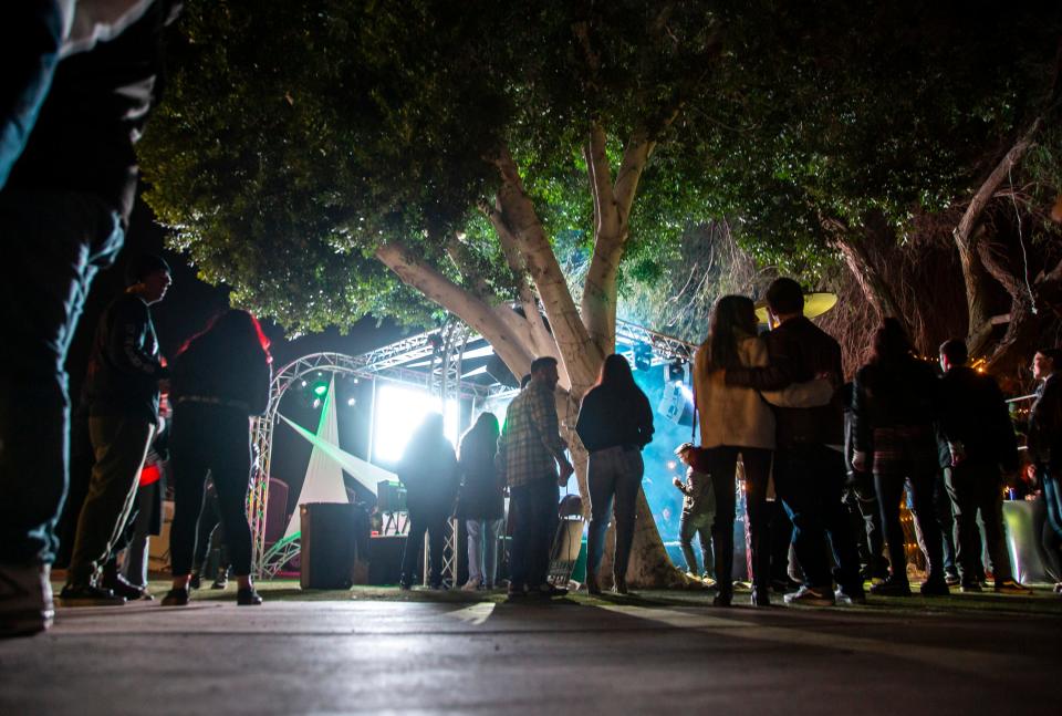 Desert Underground festivalgoers gather near the stage as Queridos de la Sierra perform in Coachella, Calif., Friday, Jan. 27, 2023. 