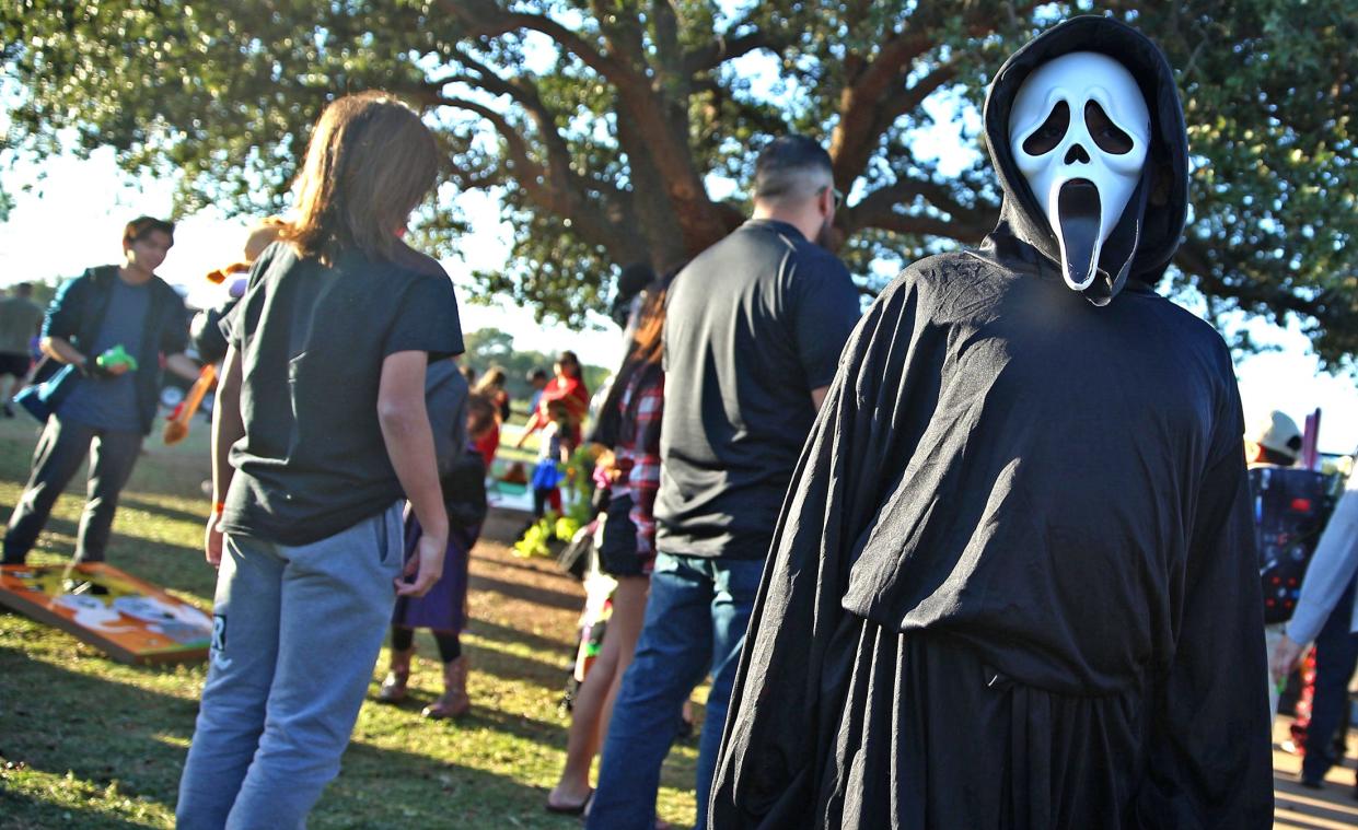 A group of people attend the Boo Bash Halloween event at Bowie Elementary School on Thursday, Oct. 28, 2021.