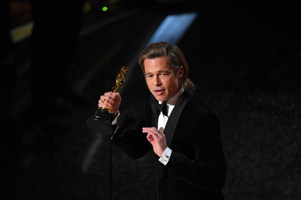 Brad Pitt accepts the award for best performance by an actor in a supporting role for his role in "Once Upon a Time in Hollywood" during the 92nd Academy Awards.