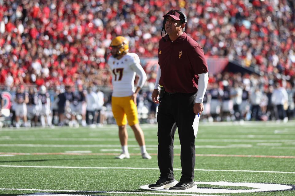 Head coach Shaun Aguano of the Arizona State Sun Devils reacts during a time-out from the NCAAF game against the Arizona Wildcats at Arizona Stadium on Nov. 25, 2022, in Tucson, Arizona. This year's game is the 96th annual Territorial Cup match between Arizona's rival schools.