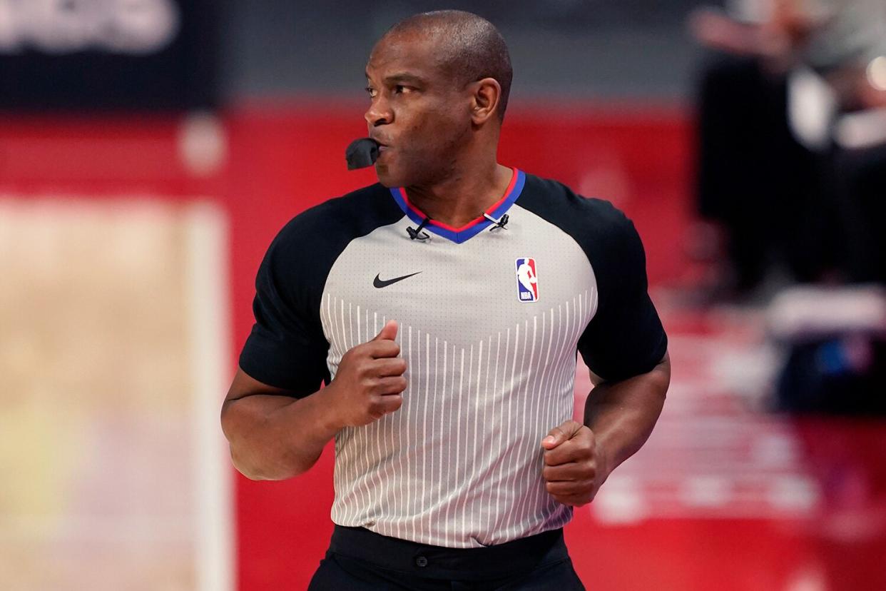 Referee Tony Brown runs on the sideline during the first half of an NBA basketball game between the Detroit Pistons and the Toronto Raptors, Wednesday, March 17, 2021, in Detroit. NBA referee Tony Brown, who was diagnosed with Stage 4 pancreatic cancer in March, says his treatment is going well and he’s hopeful of possibly returning to the court at some point this season.