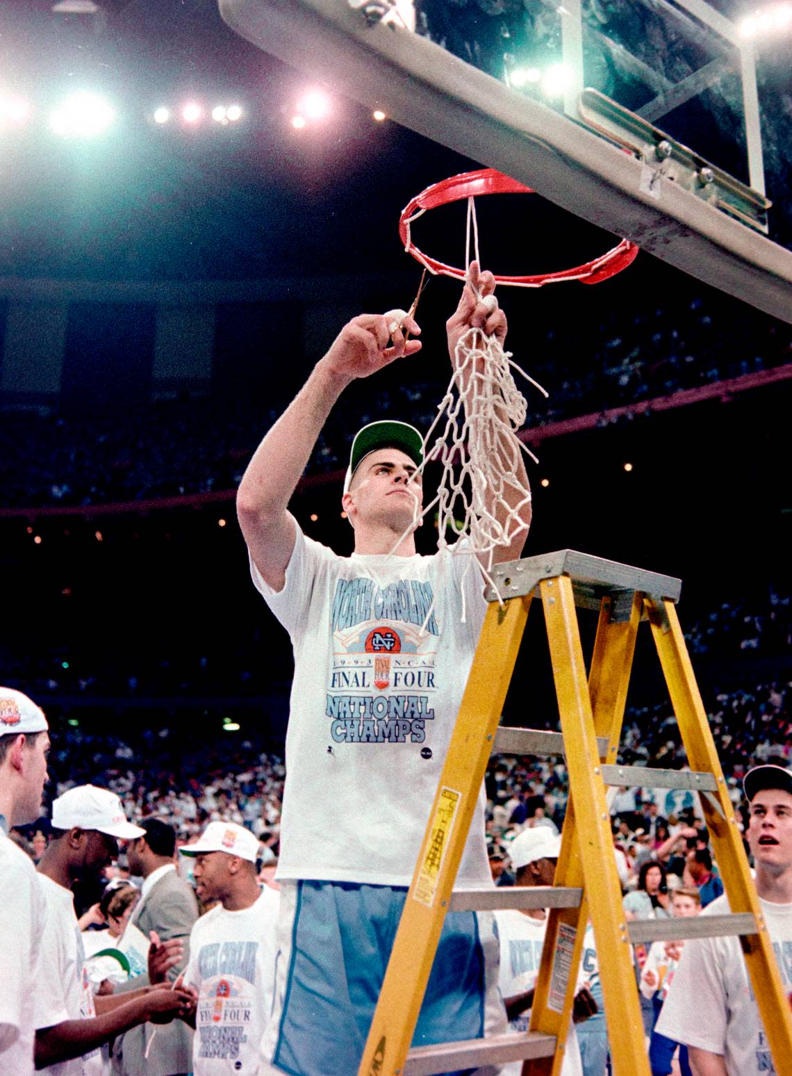 UNC center Eric Montross cuts down a portion of the nets after the Tar Heels defeated Michigan to win the NCAA championship game in New Orleans in 1993.