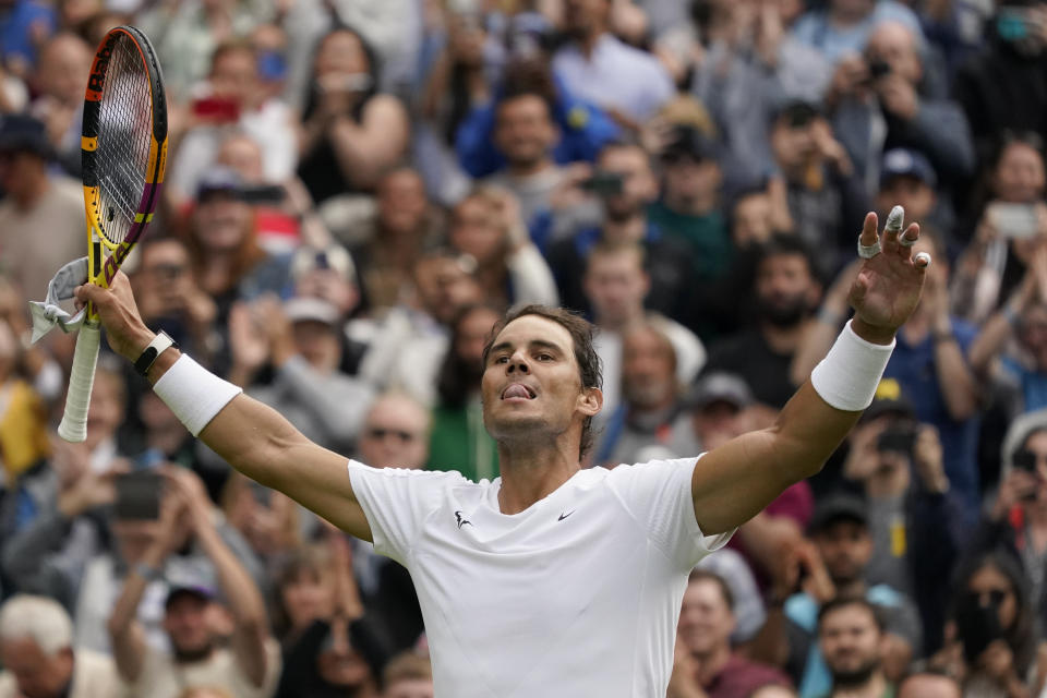 Spain's Rafael Nadal celebrates after winning against Argentina's Francisco Cerundolo in a first round men's singles match on day two of the Wimbledon tennis championships in London, Tuesday, June 28, 2022. (AP Photo/Alberto Pezzali)