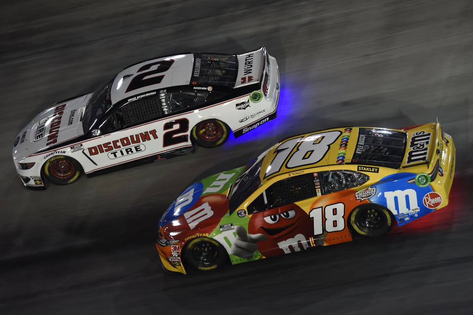 BRISTOL, TENNESSEE - JULY 15: Kyle Busch, driver of the #18 M&M's Toyota, races Brad Keselowski, driver of the #2 Discount Tire Ford, during the NASCAR Cup Series All-Star Race at Bristol Motor Speedway on July 15, 2020 in Bristol, Tennessee. (Photo by Jared C. Tilton/Getty Images)