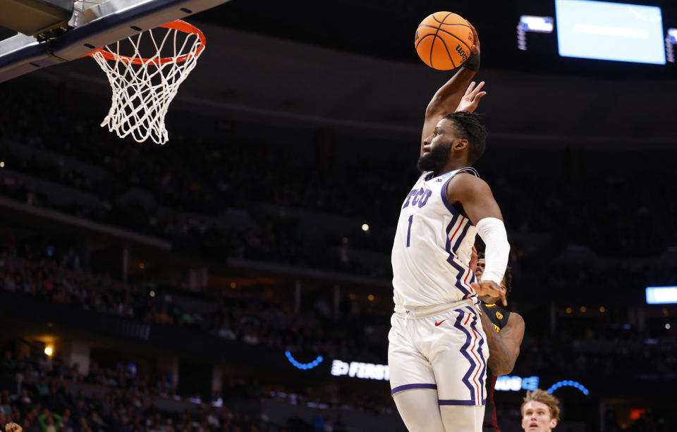 Mar 17, 2023; Denver, CO, USA; TCU Horned Frogs guard Mike Miles Jr. (1) dunks during the first half against the Arizona State Sun Devils at Ball Arena. Mandatory Credit: Michael Ciaglo-USA TODAY Sports