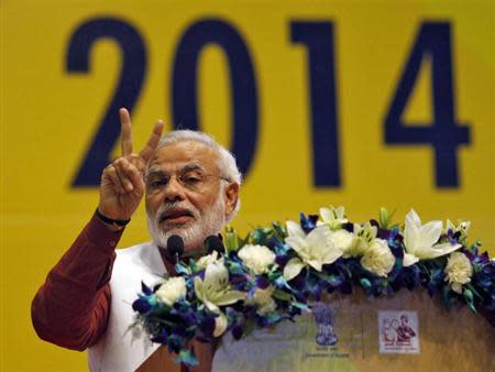 Hindu nationalist Narendra Modi, prime ministerial candidate for the main opposition Bharatiya Janata Party (BJP) and Gujarat's chief minister, gestures while addressing the National Education Summit in Gandhinagar, in the western Indian state of Gujarat, January 10, 2014. REUTERS/Amit Dave/Files