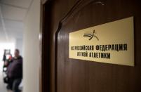 A sign on display saying "Russian Federation of Athletics" is pictured in Moscow