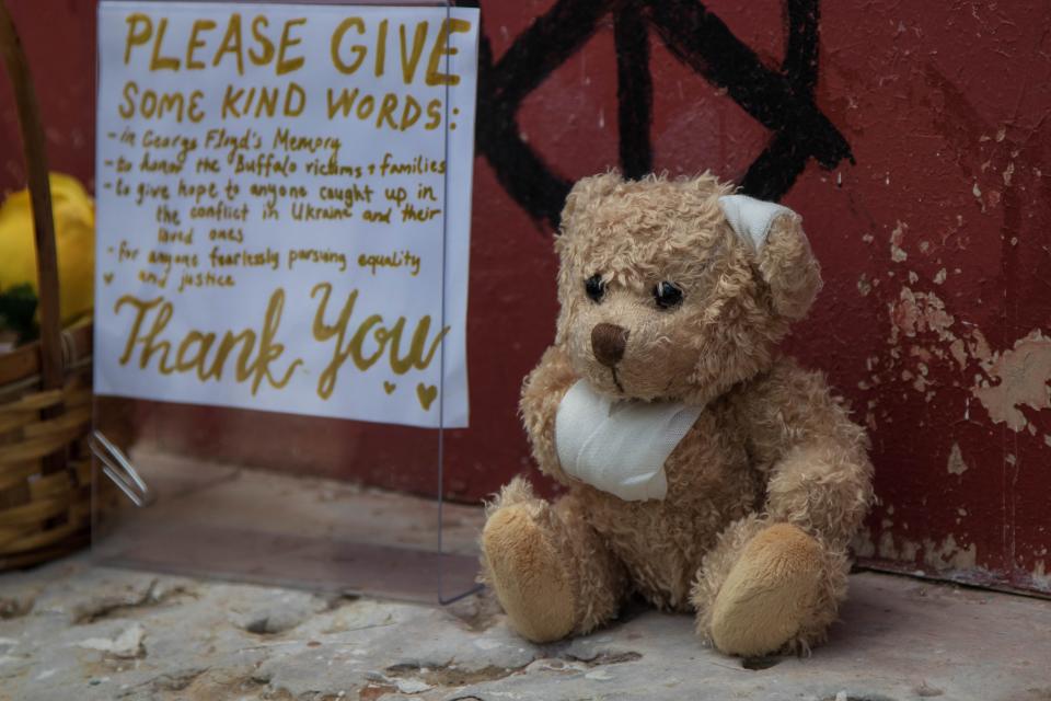 A small teddy bear that Paula Davis, owner of Blooms & Petals, left at the George Floyd mural, to honor the 19 children and two teachers killed at Robb Elementary School in Uvalde, Texas, on May 24, 2022, on May 25, 2022, in Lafayette.