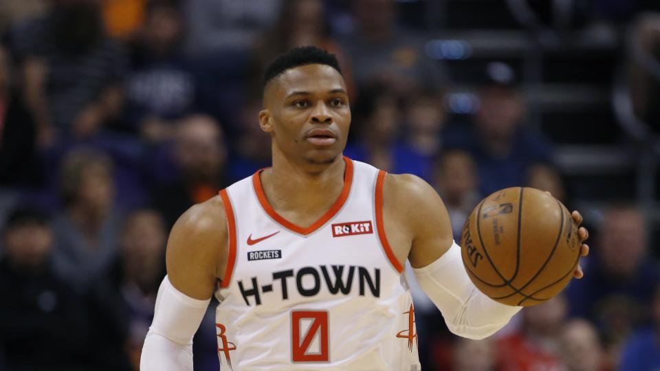 Houston Rockets guard Russell Westbrook dribbles the ball against the Phoenix Suns during the first half of an NBA basketball game Saturday, Dec. 21, 2019, in Phoenix. The Rockets defeated the Suns 139-125. (AP Photo/Ross D. Franklin)