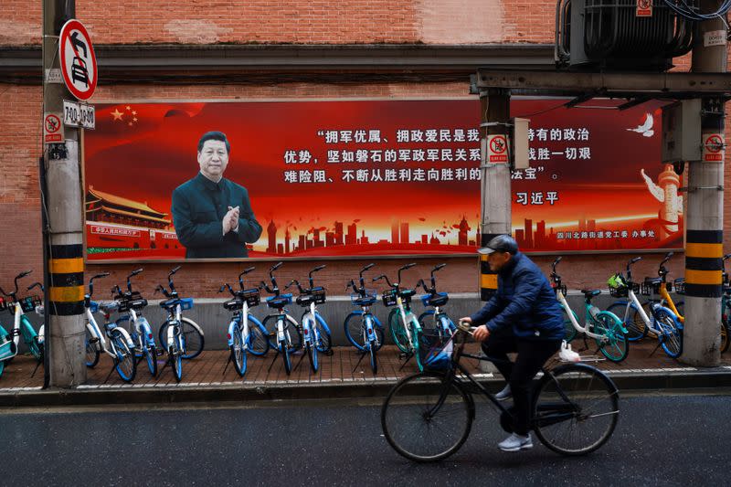 Pictures of Chinese President Xi Jinping overlook a street ahead of the National People's Congress (NPC), in Shanghai