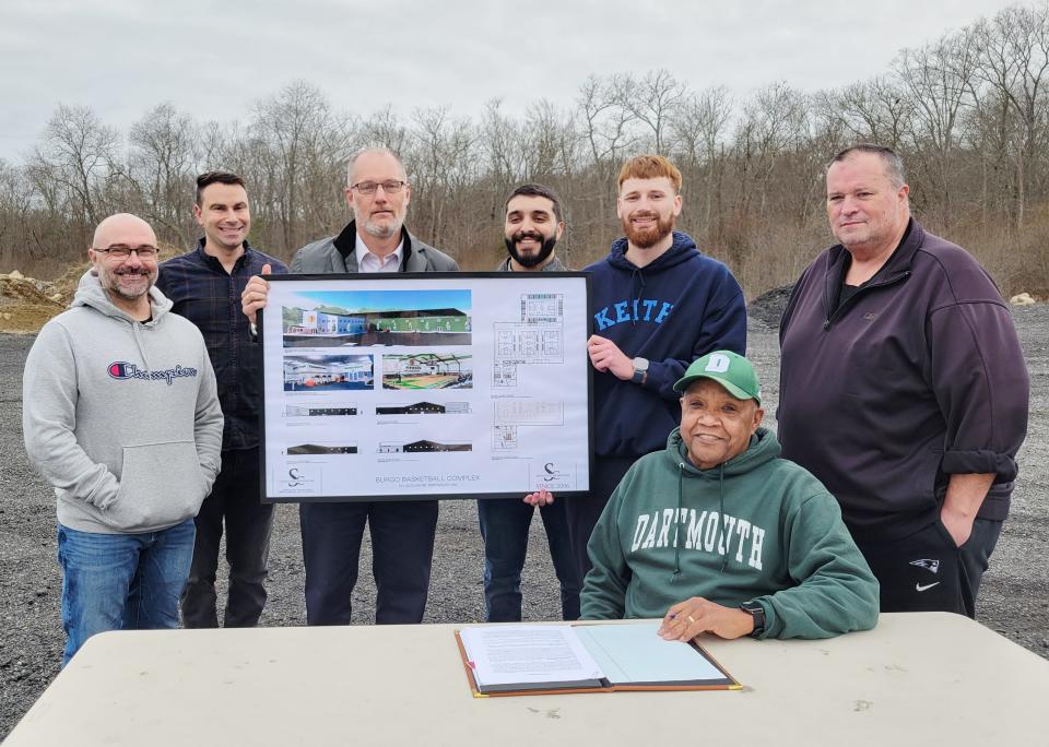 Steven Burgo (seated) with (left to right) BBA board members Ray Medeiros, Geoffrey Faucher, Alekz Hirschmann, Preston LaBonte and Graham Gisherman and Dartmouth Select Board Vice Chair Shawn McDonald after Burgo signed a 30-year lease.