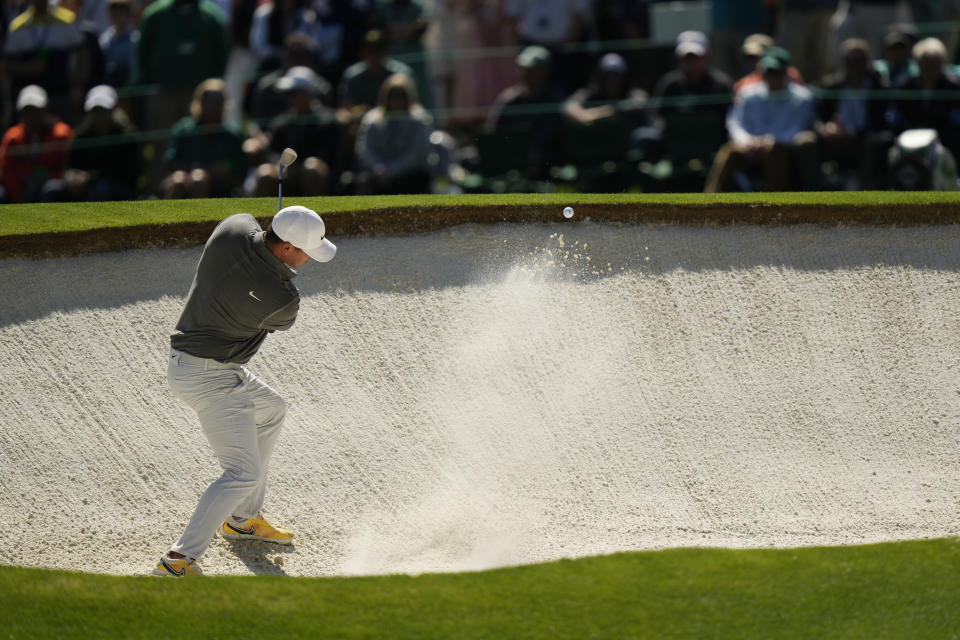 Brooks Koepka hits from the bunker on the fourth hole during the final round of the Masters golf tournament at Augusta National Golf Club on Sunday, April 9, 2023, in Augusta, Ga. (AP Photo/Charlie Riedel)