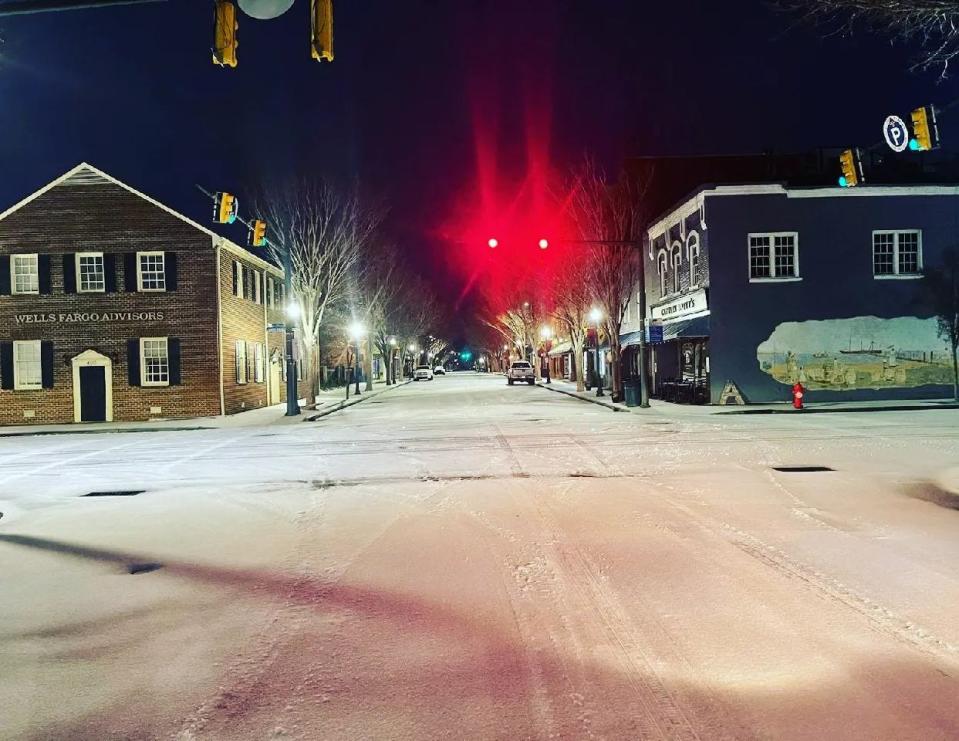 Snow blankets Middle Street in downtown New Bern on Saturday morning.