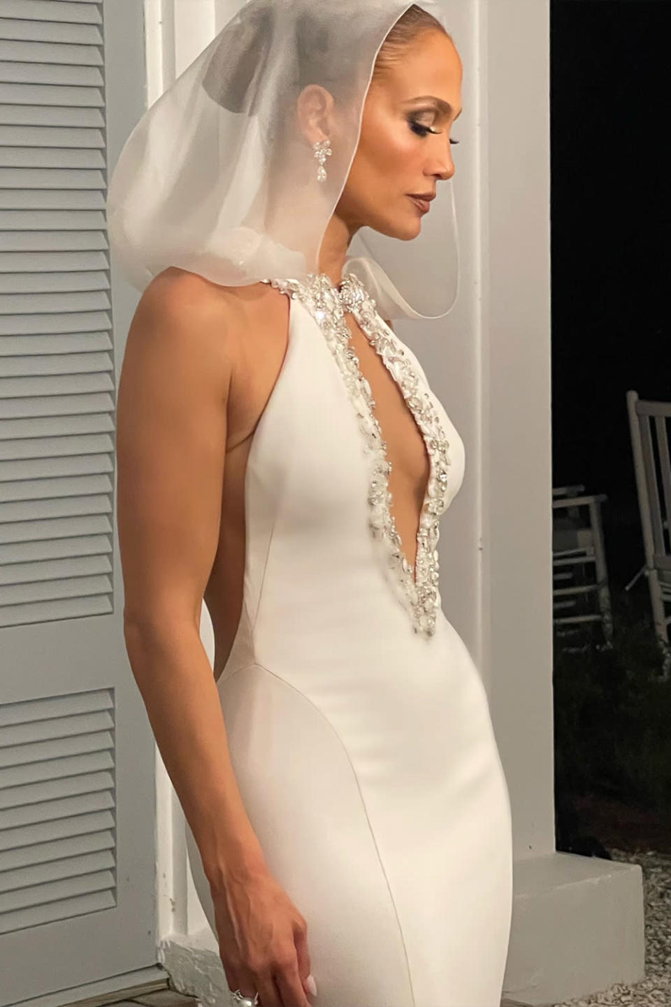 <p>The party outfit featured a sleek mermaid silhouette and a removable hood. The look also had a keyhole neckline embellished with Swarovski crystals of varying sizes.</p>