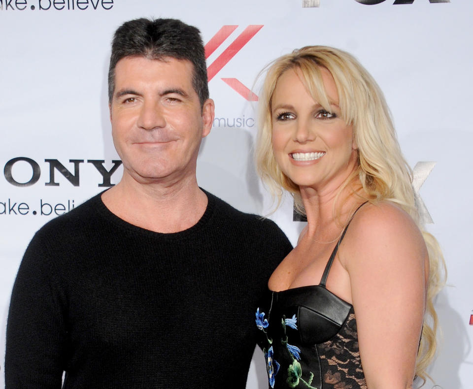 Simon Cowell and singer Britney Spears arrive at FOX's 