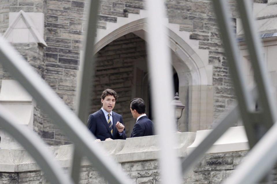 Prime Minister Justin Trudeau, left, and Mexican President Enrique Pena Nieto talk as they attend a dinner at Casa Loma in Toronto on Monday, June 27, 2016. THE CANADIAN PRESS/Nathan Denette