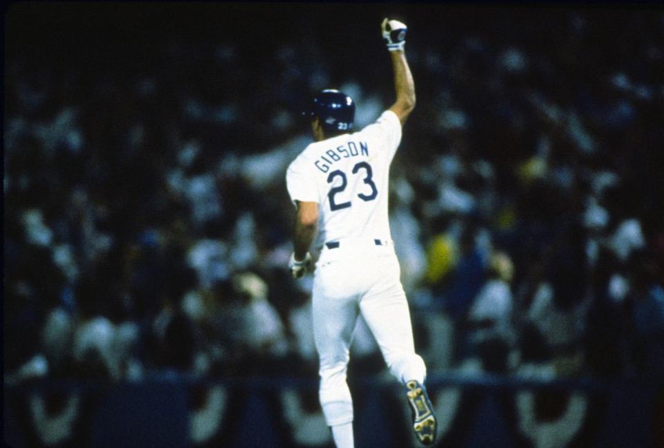 <p><strong>October 15, 1988</strong>: Bobby Thompson, Bill Mazeroski, and Kirk Gibson. That's the short list for most dramatic postseason homers ever, and Gibson's pinch-hit poke—with a bad wheel, against an unhittable Dennis Eckersley, with the Dodgers a run down in the ninth to the heavily favored A's in Game 1 of the World Series—may be the most electric ever.<br><br>Before Gibson could have the signature moment of his notable career, he had to battle from two strikes down to a full count, and his dribbler up the first-base line stayed just foul. Finally, though, Eckersley, who had thrown nothing but fastballs to the ailing Gibson, made the biggest mistake of his career.<br><br>"I was tired of throwing fastballs, so I thought to myself, if I give him something off-speed, maybe he'll pull it off," Eck told ESPN in 2008. “It was really stupid, because something off-speed is probably the only thing he can get to at this point.”<br><br>Gibson was waiting on the backdoor slider and rocked it 400 feet, over the right-field fence. The Dodgers won Game 1 and took the Series in five games. Eckersley and the A's would win the earthquake-interrupted '89 Series, against the Giants. But this moment belonged to Los Angeles.<br><br>"When Gibson hit that home run, I jumped up onto my mom's coffee table and broke it," remembers Millar. "Growing up in L.A. as a Dodger fan, this was a tremendous moment."<br> </p>