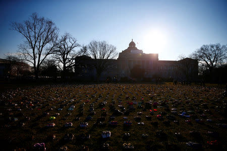 Activists install 7000 shoes on the lawn in front of the U.S. Capitol on Capitol Hill in Washington, U.S. March 13, 2018. REUTERS/Eric Thayer