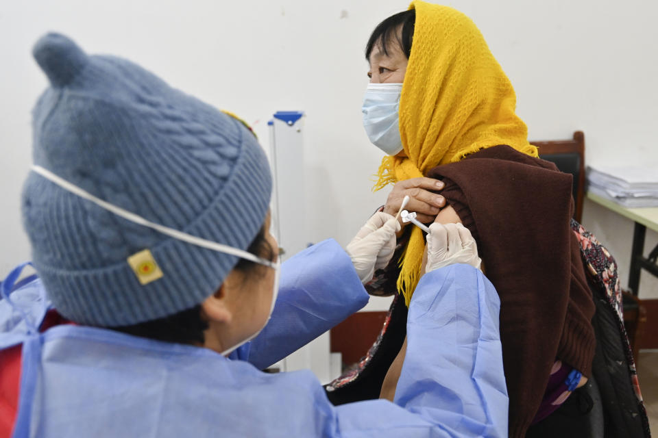 WEIFANG, CHINA - DECEMBER 29, 2022 - A medical worker inoculates a citizen with a second dose of booster vaccine at a centralized COVID-19 vaccination site in Weifang, East China's Shandong province, Dec 29, 2022. (Photo credit should read CFOTO/Future Publishing via Getty Images)